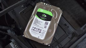 A Seagate Barracuda hard drive, sitting on top of a PC.